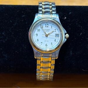 Citizen women's two-tone quartz watch white dial date 50 meters water resistance